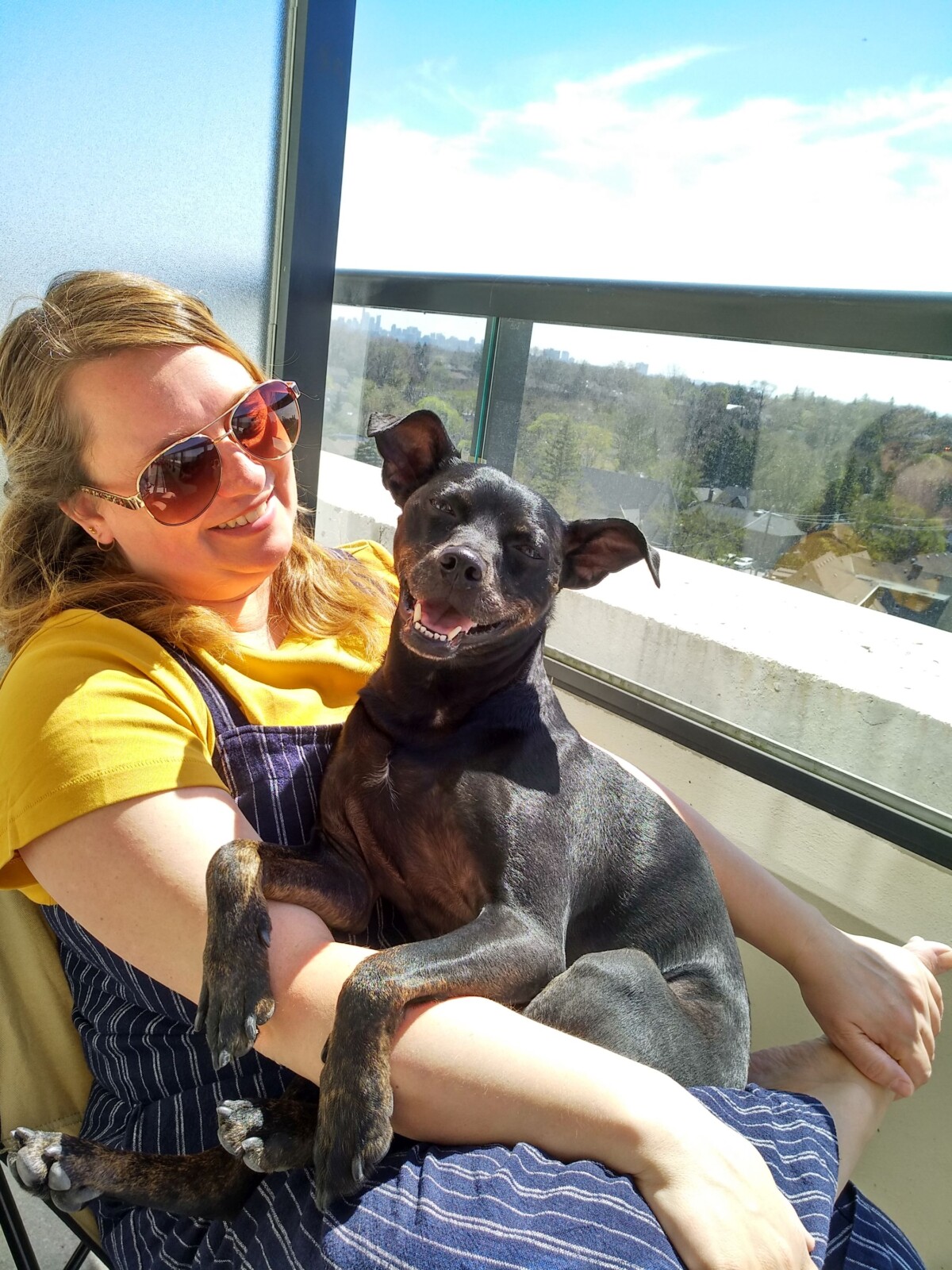Nina and our dog, Dash on our balcony